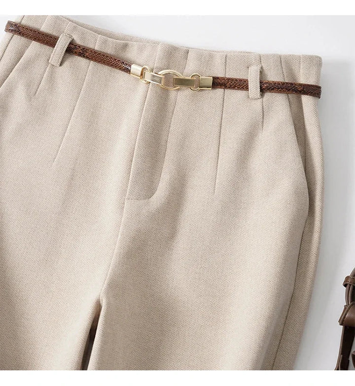 Side profile of tailored wool trousers showing structured drape and clean lines