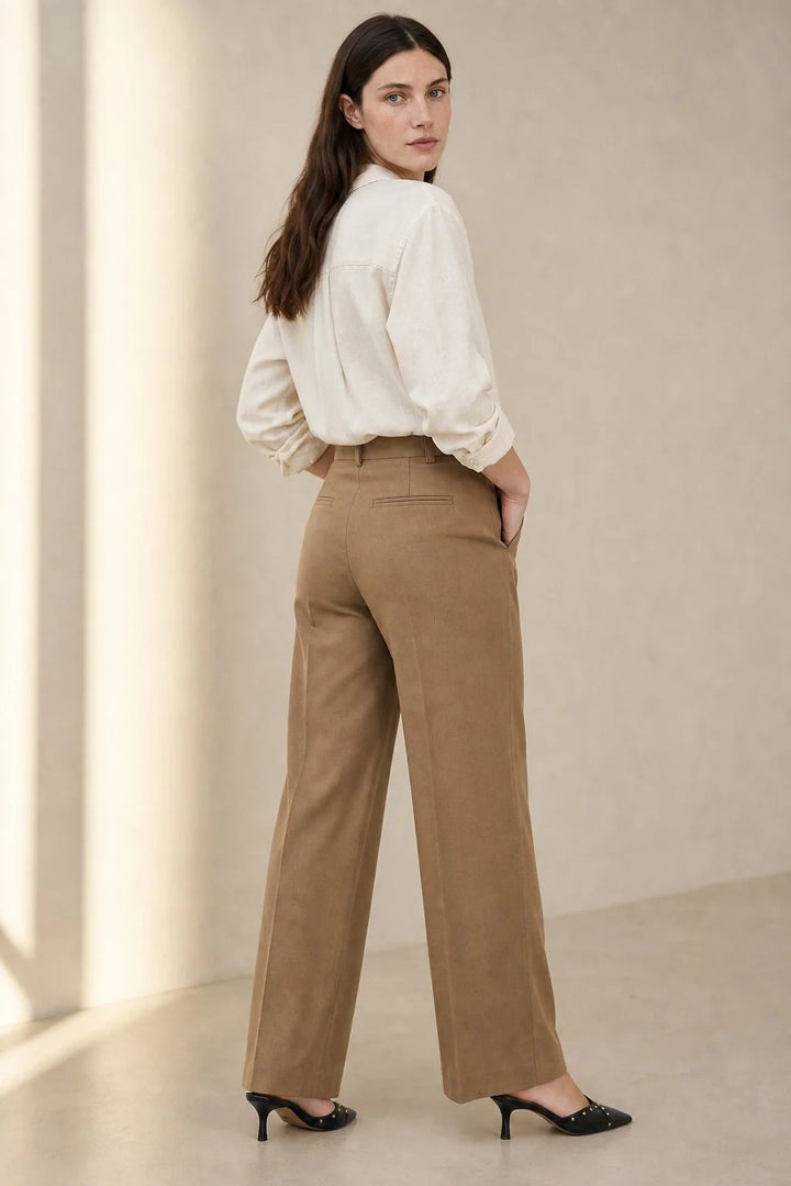 Detail of wool trousers waistband with belt loops and matching slim belt included