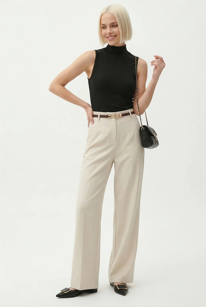 Full length view of tailored wool trousers with high waist and pressed creases