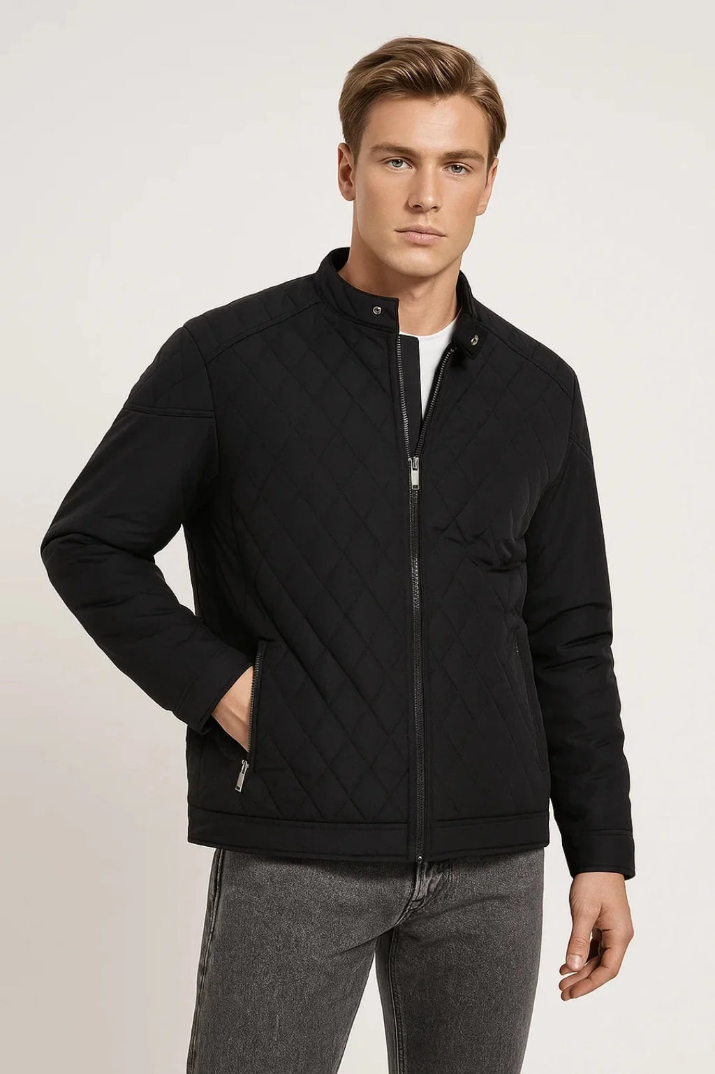 Men's quilted jacket in black with diamond stitch design and stand-up collar worn over white tee