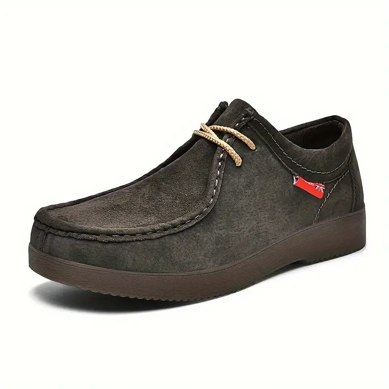 Men's moccasin slip-on shoes in dark grey with contrast stitching and textured rubber sole