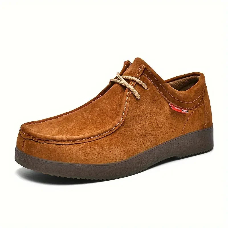 Side view of men's moccasin loafers showing rounded toe and two-eyelet lace detail