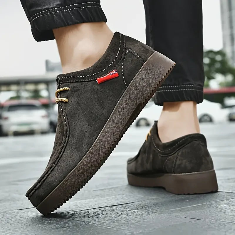 Top view of men's slip-on loafers showing lace detail and smooth upper finish