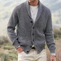 Men's ribbed knit cardigan in grey with shawl collar and button-front closure worn casually outdoors
