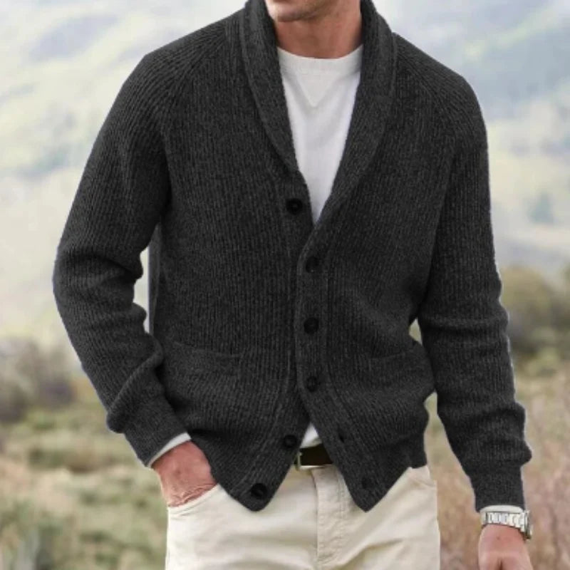 Close-up view of men's ribbed knit cardigan showing textured fabric and patch pockets