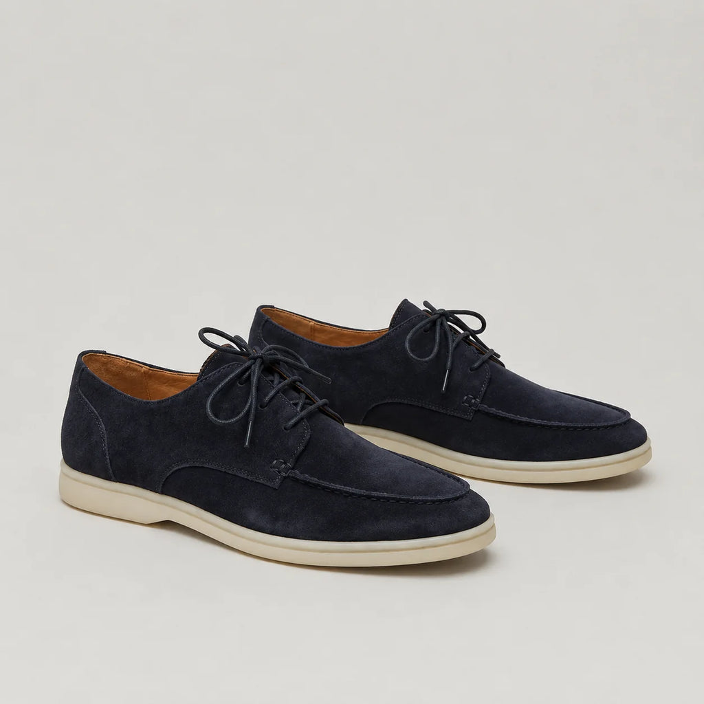 Men's beige suede loafers featuring minimalist design and flexible sole for everyday comfort