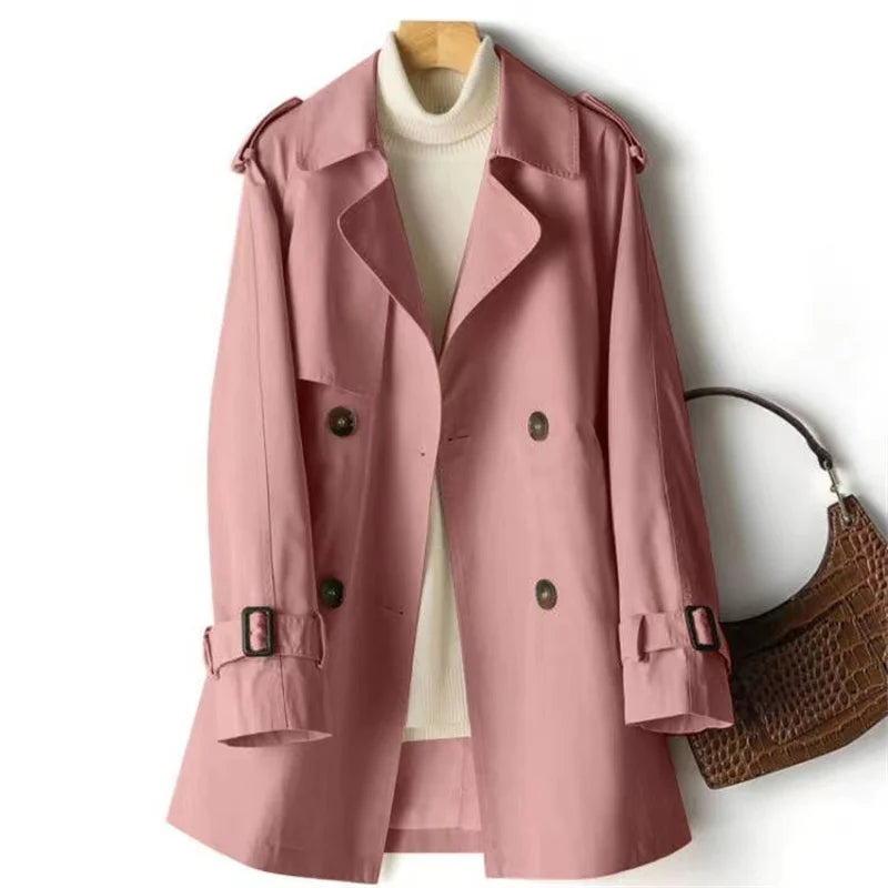 Adjustable buckle-tab cuff detail on women's trench coat sleeve with smooth woven fabric