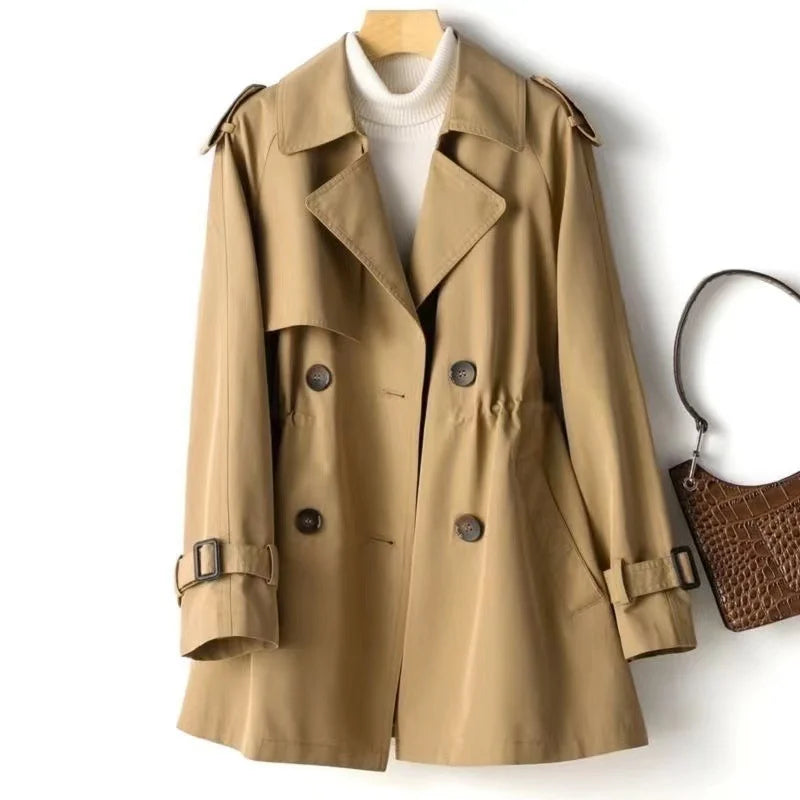 Back view of trench coat displaying clean lines and tailored waist detail