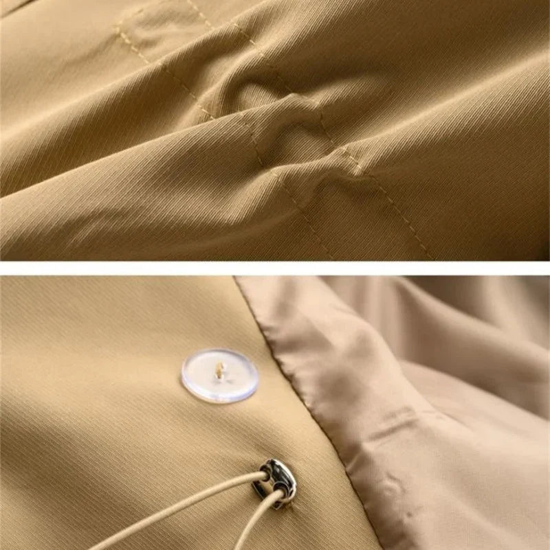 Detail of shoulder epaulet and lapel construction on double-breasted trench coat