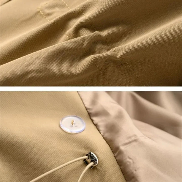Detail of shoulder epaulet and lapel construction on double-breasted trench coat