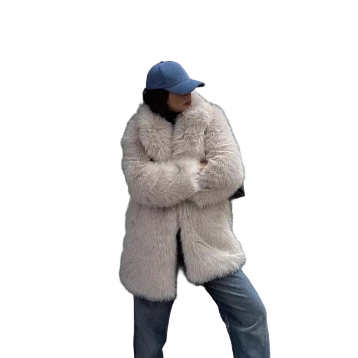 Women's faux fur coat in off-white with open front and wide notched lapels styled with blue cap
