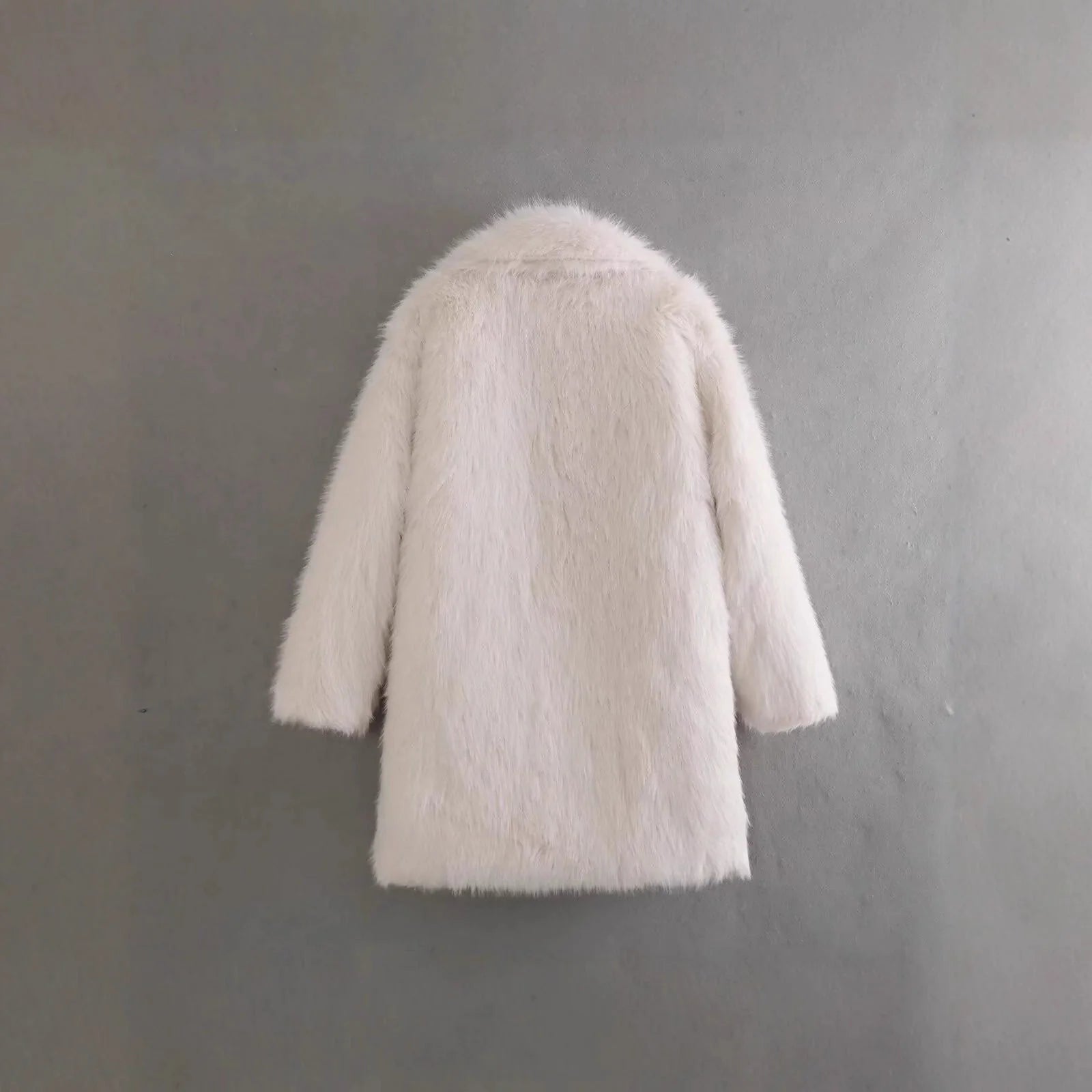 Women's textured faux fur coat with notched lapels and mid-length silhouette for winter styling