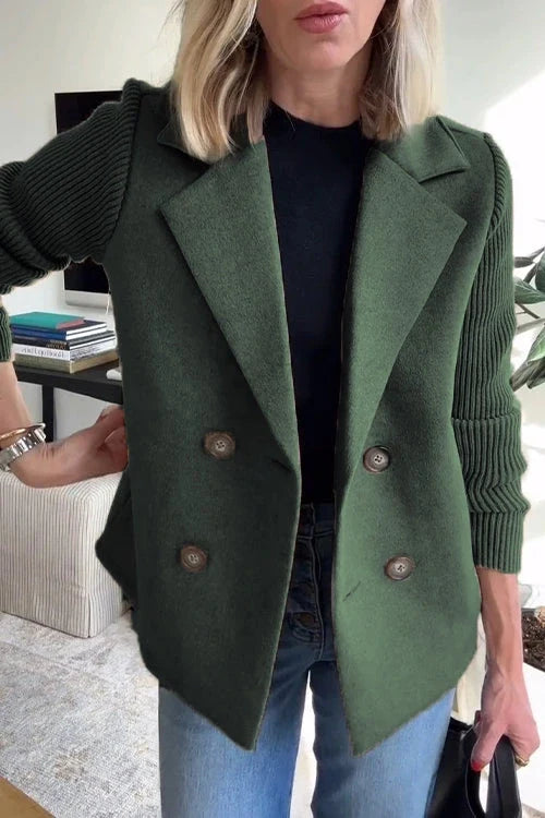 Detail of double-breasted button arrangement on knit blazer