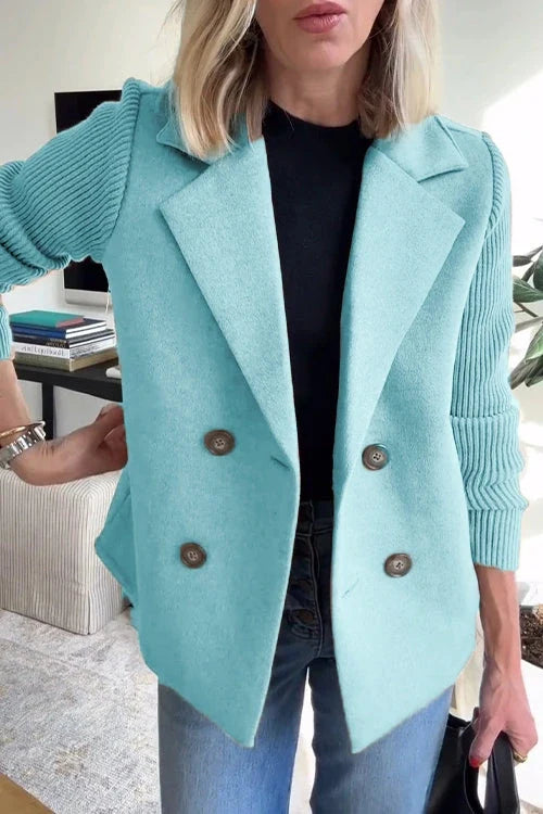 Knit double-breasted blazer showing comfortable drape and structured shoulders