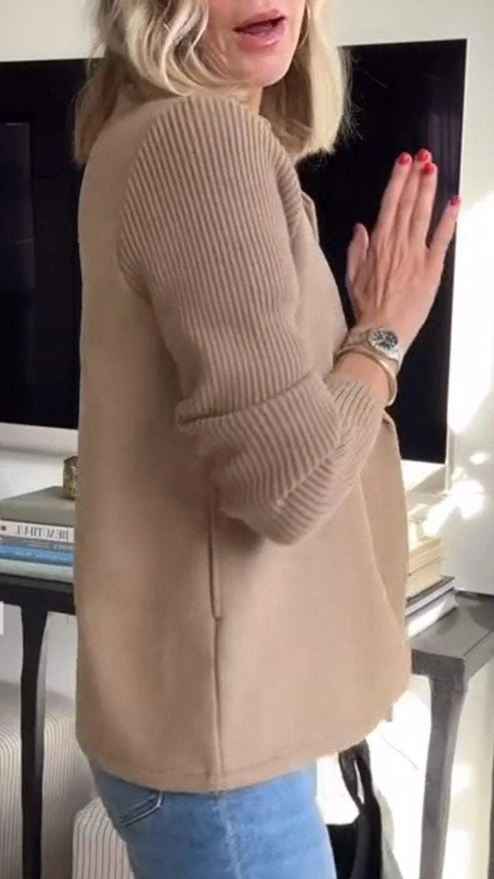 Side view of women's knit blazer with relaxed drape and tailored silhouette