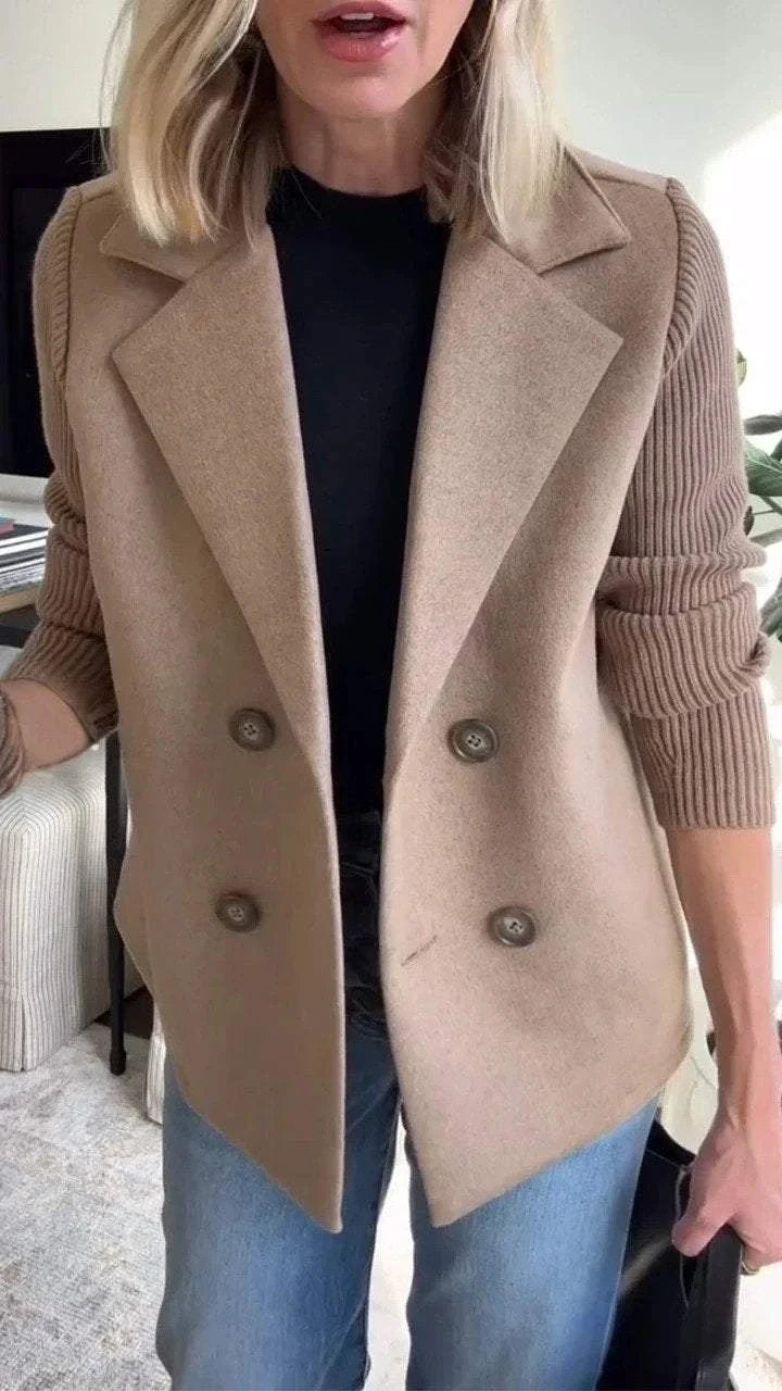 Women's camel knit blazer styled over black top with side pocket detail visible