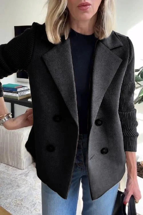 Women's knit blazer worn unbuttoned showing relaxed fit and drape