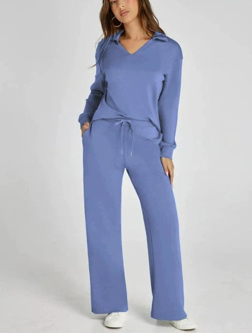 Side profile of women's lounge set with V-neck top and wide-leg trousers in relaxed silhouette