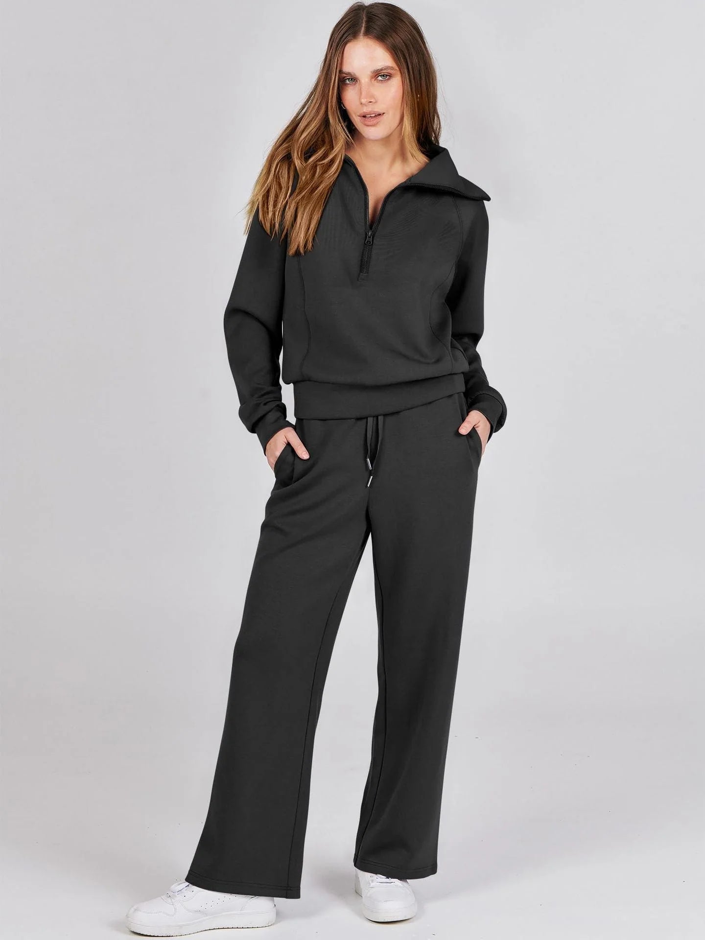 Close-up of V-neck detail and ribbed cuffs on women's lounge set top with relaxed fit