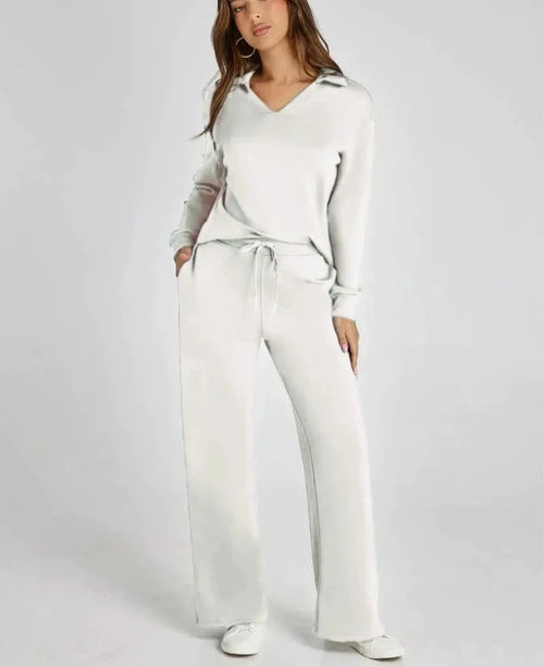 Close-up view of women's lounge set showing V-neck detail and relaxed fit top with ribbed cuffs