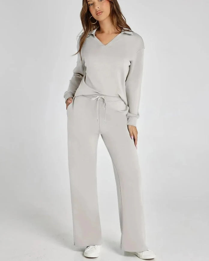 Side angle of women's wide-leg lounge trousers with adjustable drawstring waist and flowing silhouette