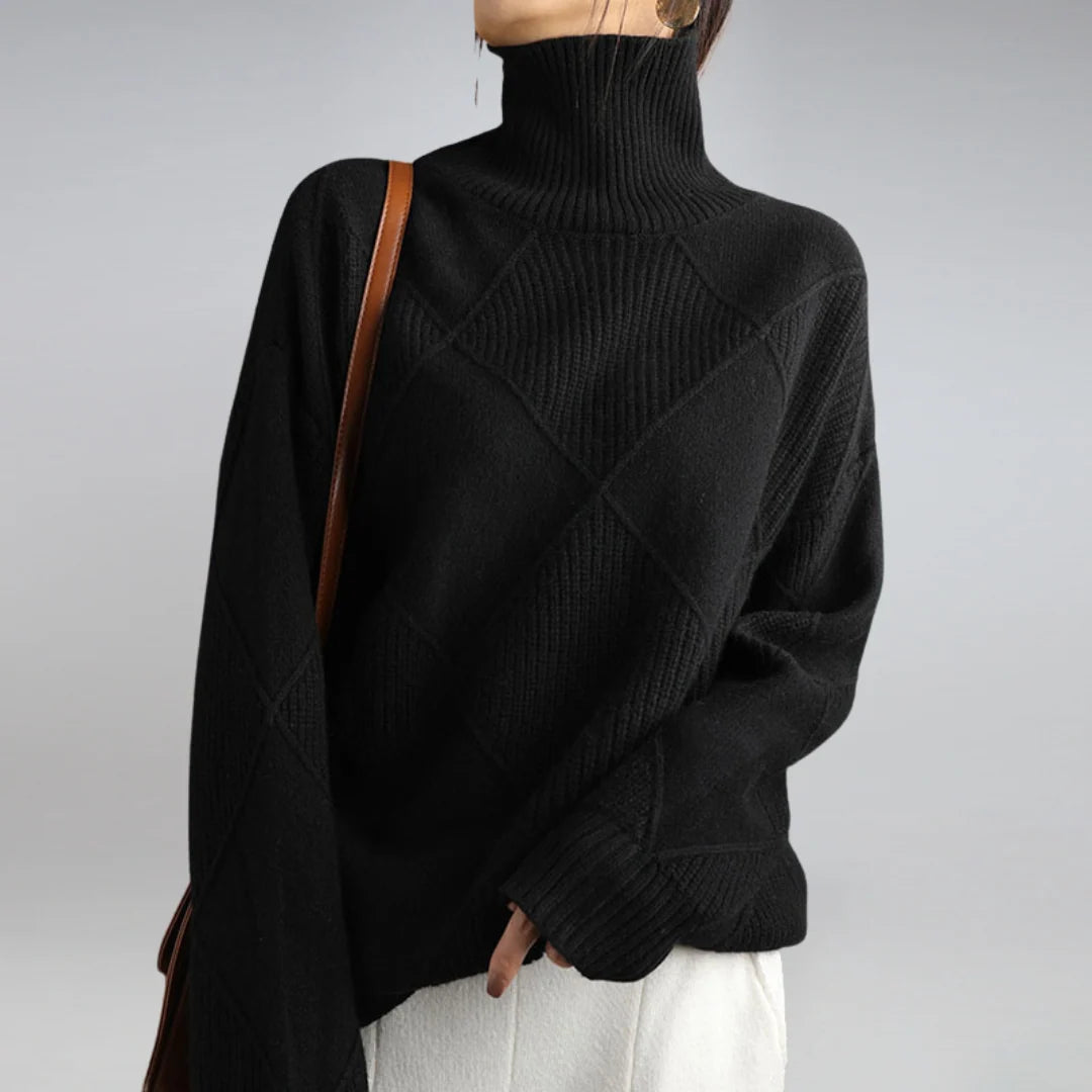 Women's turtleneck jumper in black with relaxed fit and ribbed knit texture worn with white trousers