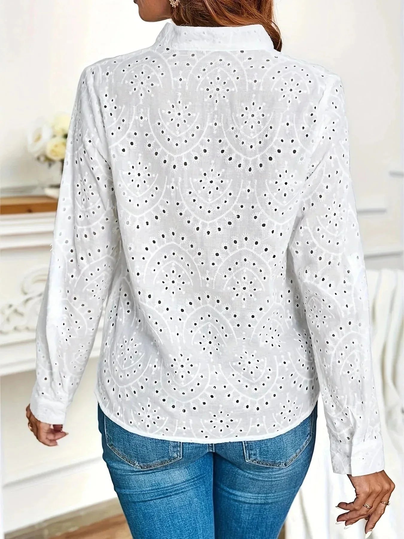 Full-length view of women's blouse with V-neck and roll-up sleeves paired with trousers