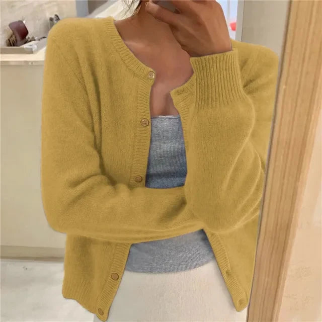 Full-length view of cropped cardigan in grey showing relaxed silhouette and ribbed trims