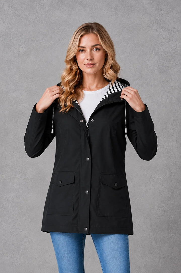 Hooded waterproof jacket for women in yellow with snap closures and mid-thigh coverage