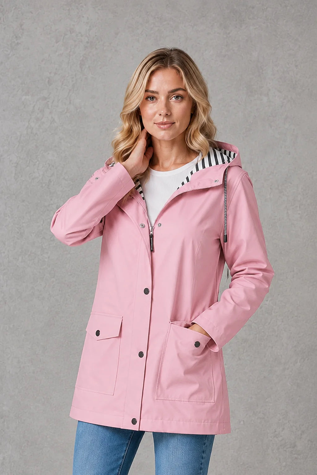 Women's raincoat with adjustable hood and striped lining detail for rainy day wear