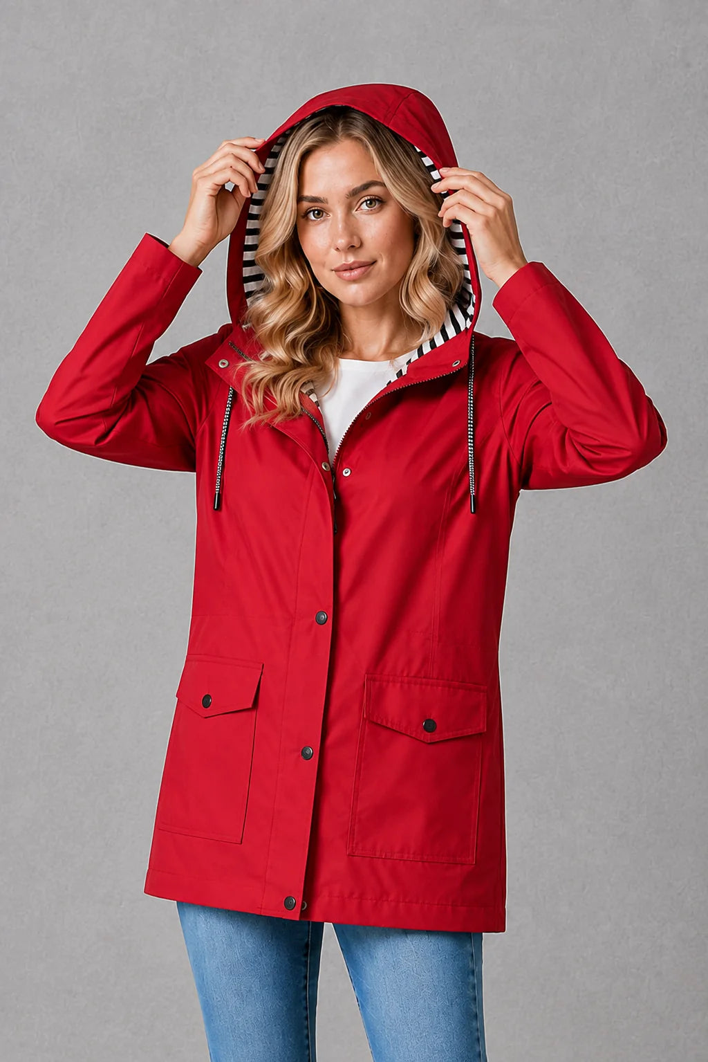 Yellow hooded raincoat featuring relaxed fit and practical design for everyday outdoor activities