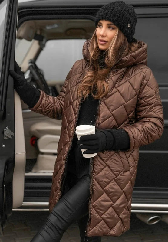 Side view of longline quilted puffer coat with extended length and side pockets
