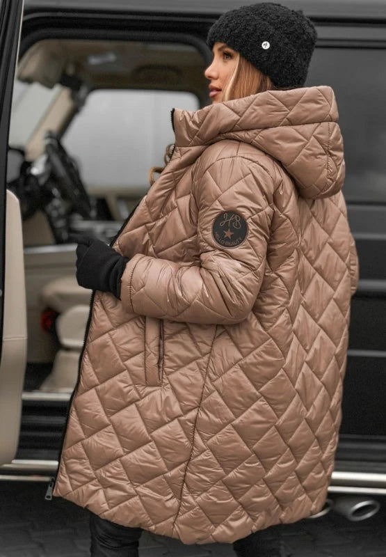 Detail of quilted puffer coat hood and neckline with full-length zip closure