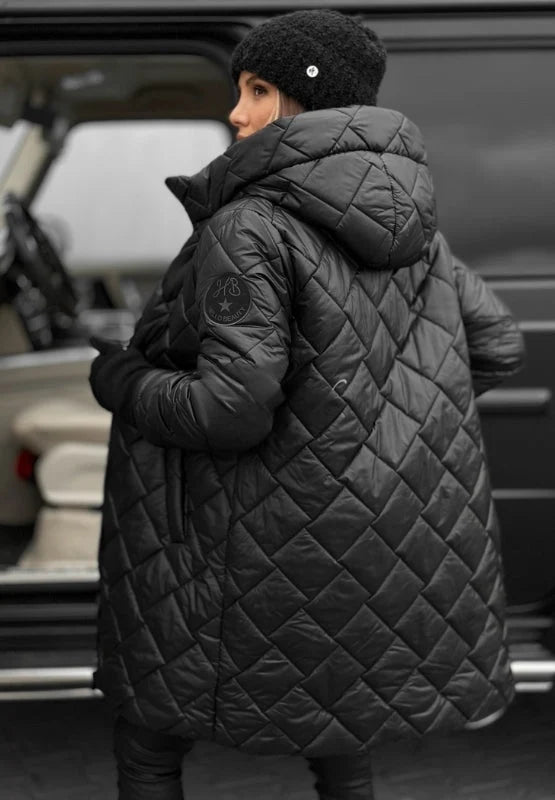 Back view of women's longline quilted puffer coat showing diamond stitching pattern