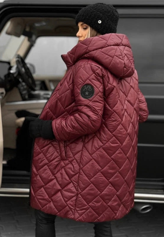 Woman wearing beige quilted puffer coat over black outfit, winter styling inspiration