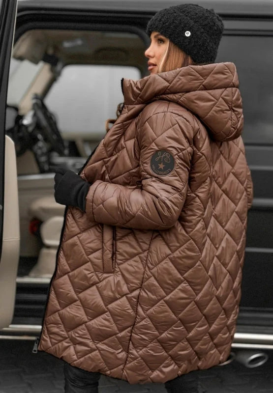 Close-up of quilted puffer coat fabric showing padded diamond panel construction