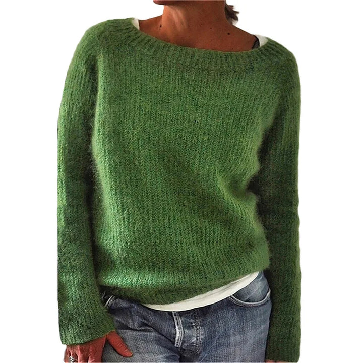 Women's black knit jumper styled with jeans for casual everyday wear