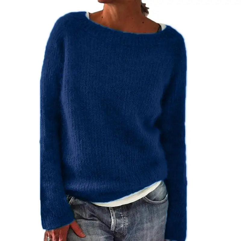 Women's relaxed knit jumper in black showing versatile layering piece styling