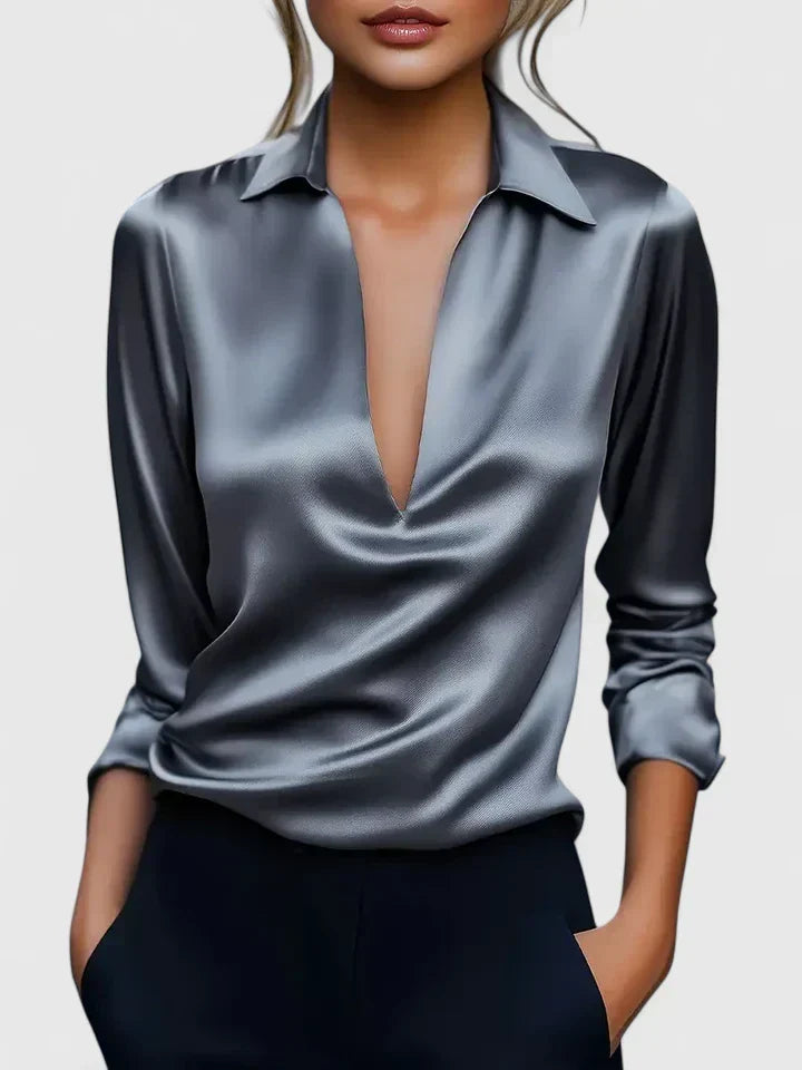 Women's satin blouse in green with V-neck and relaxed fit through body