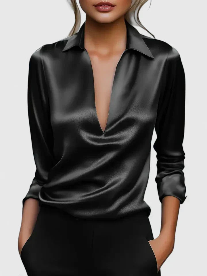 Women's burgundy satin blouse showing lustrous finish and structured collar detail