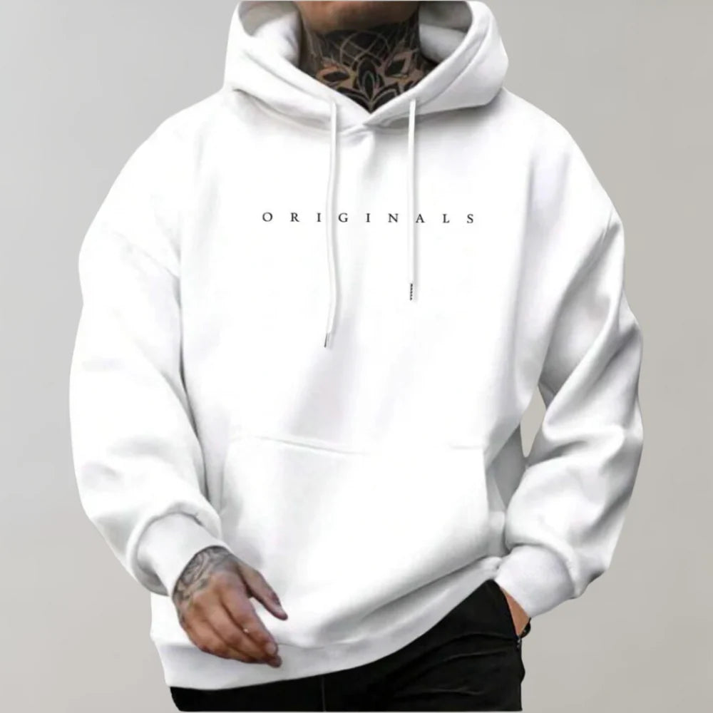 Side profile of oversized pullover hoodie displaying roomy silhouette and adjustable drawstring hood