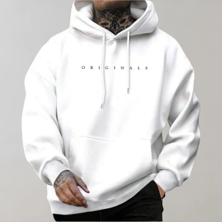 Side profile of oversized pullover hoodie displaying roomy silhouette and adjustable drawstring hood