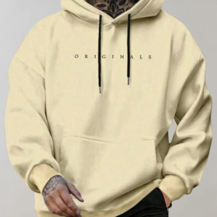 Detail shot of men's hoodie kangaroo pocket and fleece-backed fabric texture