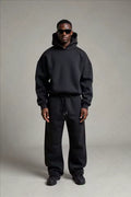 Men's casual hoodie and joggers set featuring dropped shoulders and elasticated waist