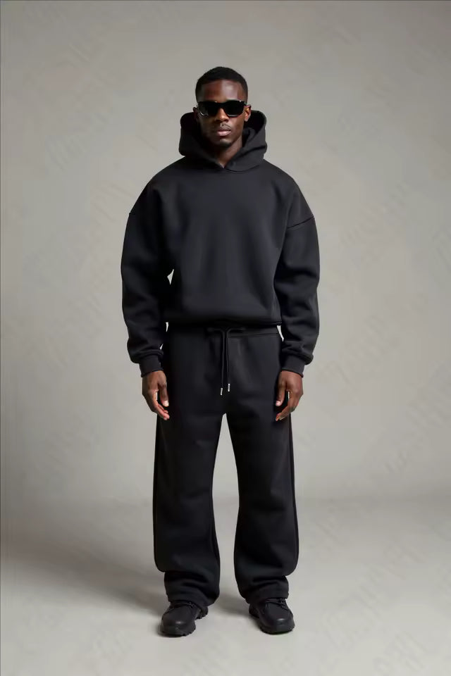 Men's casual hoodie and joggers set featuring dropped shoulders and elasticated waist
