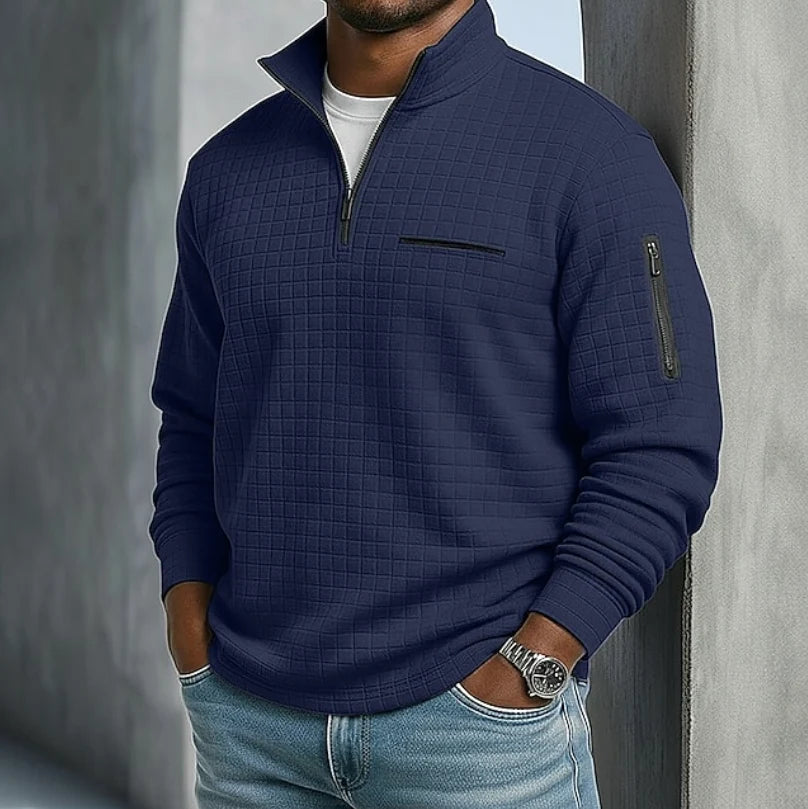 Back view of men's quilted half-zip sweatshirt showing textured grid pattern throughout
