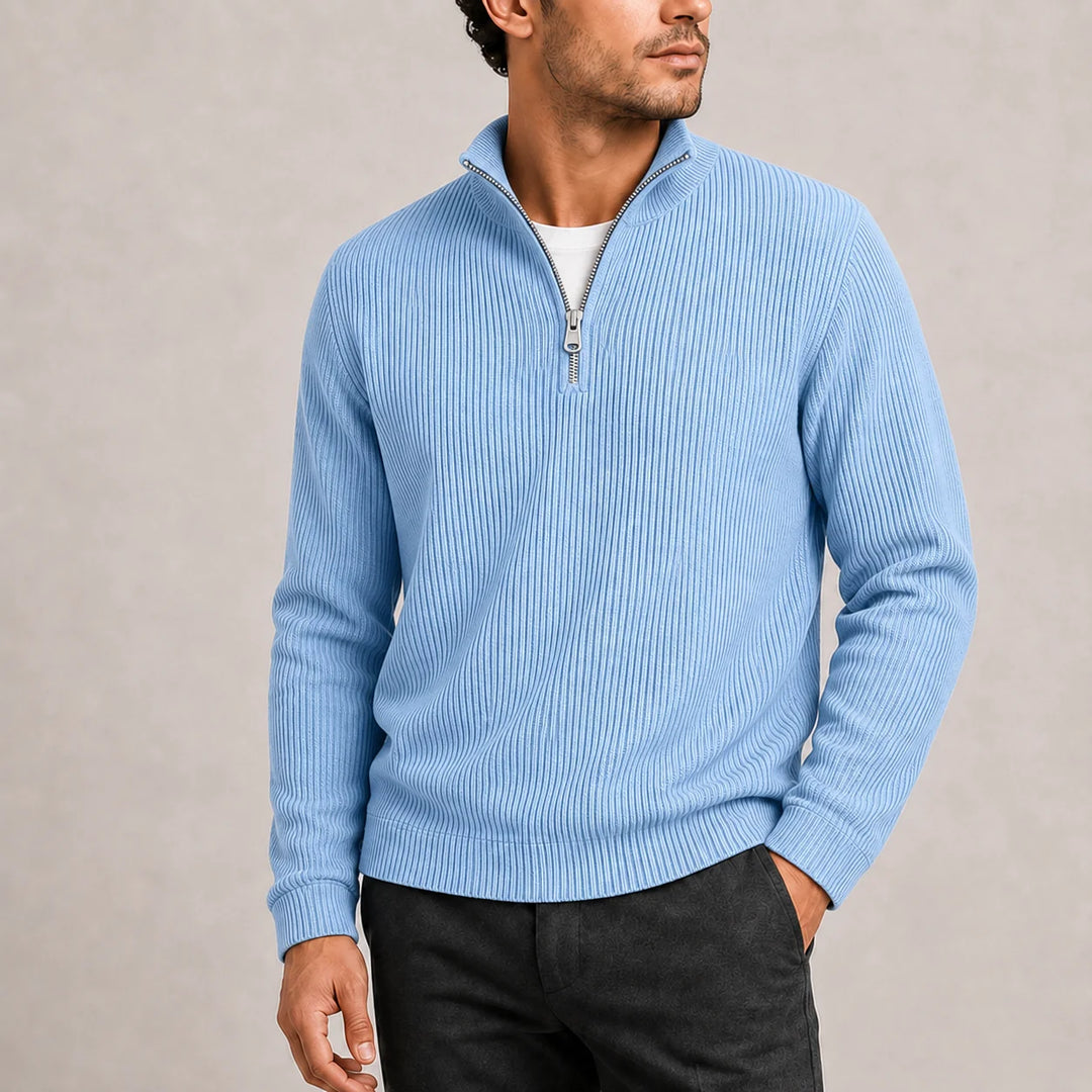Side view of men's olive green quarter-zip jumper showing relaxed fit and ribbed sleeves