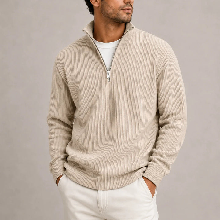 Men's ribbed jumper paired with dark tailored trousers for smart casual styling