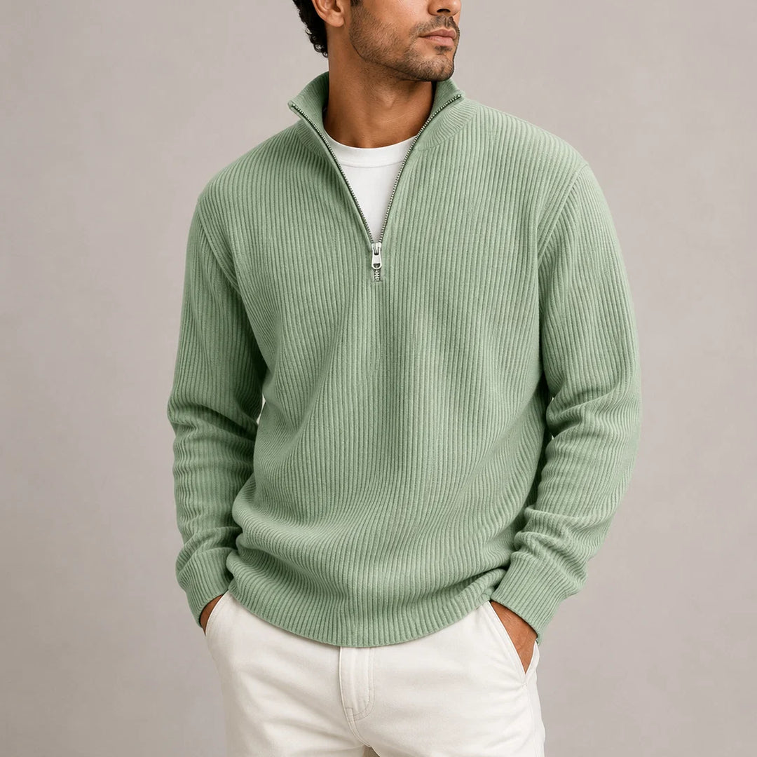 Men's olive green jumper layered over white tee for relaxed weekend look