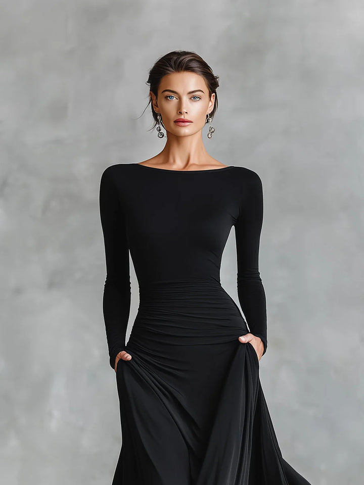 Back view of long sleeve maxi dress with boat neckline and elegant silhouette